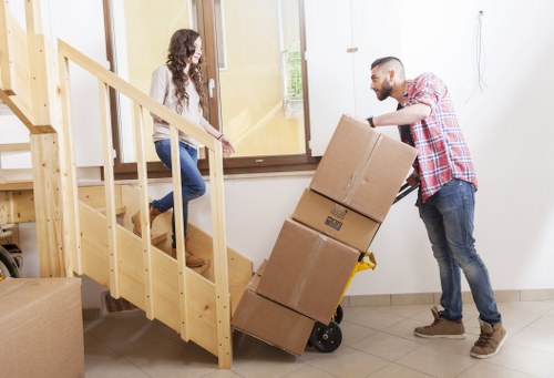 Professional packers protecting furniture during a Richmond move
